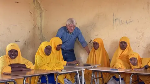 BBC Development Minister Andrew Mitchell visiting a girls' school in Dollow, Somalia