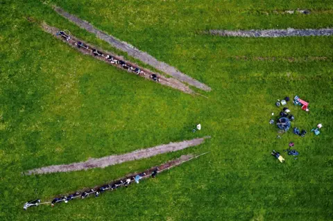DANIEL STILLER An aerial view of a tug of war match.