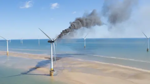 Oliv3r Drone Photography Smoke billowing from a wind turbine off the coast of Great Yarmouth