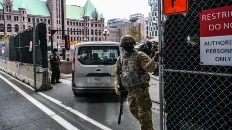 AFP National Guards and other Law enforcement officers stand guard