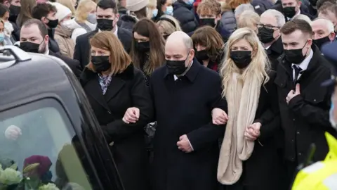 PA Media The Murphy family follow the hearse carrying Ashling Murphy's remains