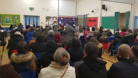 Leicestershire Police Residents and businesses attended a public meeting at a primary school nearby