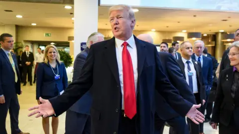 AFP/Getty US President Donald Trump promotes his economic policies at the World Economic Forum
