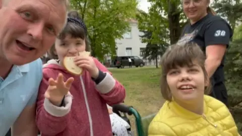 Lee Ellerker with disabled Ukrainian children in Poland