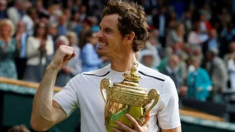 Getty Images Andy Murray celebrates with the Wimbledon trophy in 2016