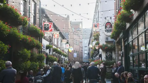 Carrie Davenport/Getty Images People at Commercial Court in Belfast's Cathedral Quarter