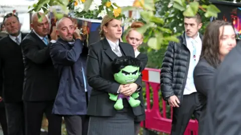 PA Coffin going into church