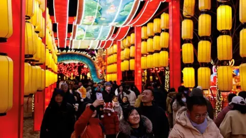 Reuters People look at light installations as part of Lantern Festival in Beijing, China