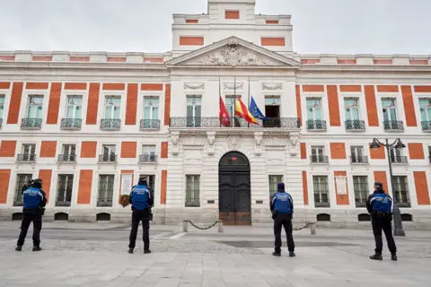 Getty Images A minute's silence on Monday in Madrid remembered the country's 7,340 coronavirus victims