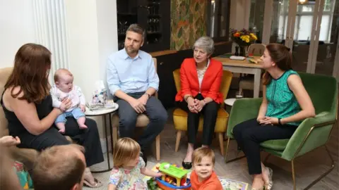 PA Media Theresa May