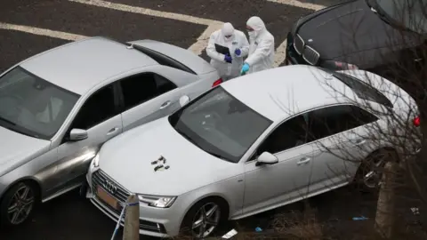 PA Police forensics officers at the scene near junction 24 of the M62