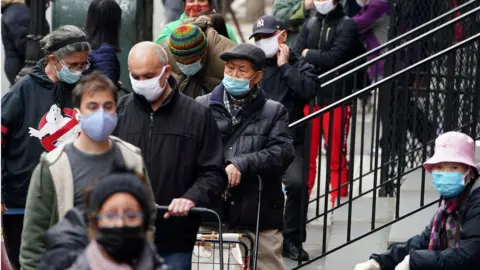 Reuters people line up for a food pantry in New York