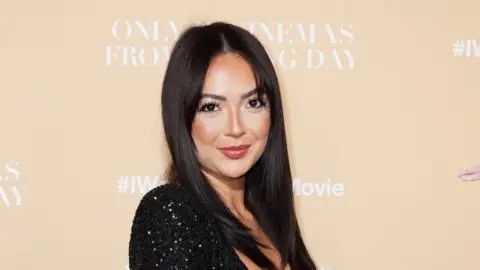 PA Media Sharon Gaffka in a black dress at an event