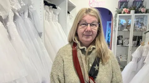 Ciara Douglas, who runs a communion dress shop, hit the headlines when she battled through floods to save her stock