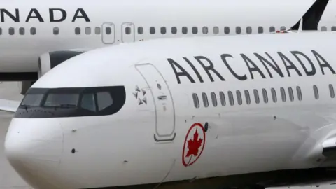 Reuters Air Canada planes are pictured in Toronto in March 2019