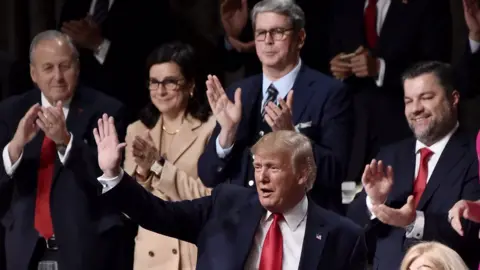 Getty Images Donald Trump is greeted warmly at the Economic Club of New York