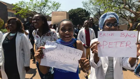 Getty Images Doctors pictured marching in Zimbabwe on Monday