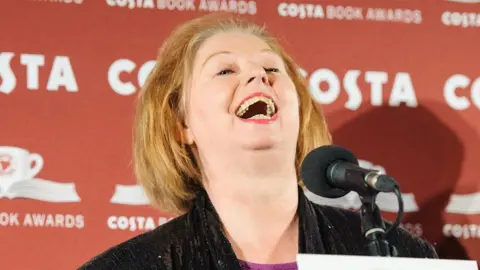 PA Media Dame Hilary Mantel at the Costa Book of the Year Awards in 2013 for Bring up the Bodies