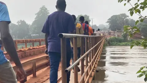 People crossing the bridge in Bambari, CAR