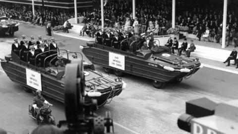 DUKWs of the Royal Navy passing King George VI, the Queen and Winston Churchill at the London Victory Celebrations in June 1946