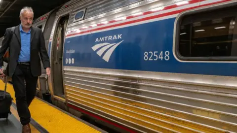 Getty Images Many Amtrak passenger trains run on tracks that belong to the freight rail companies