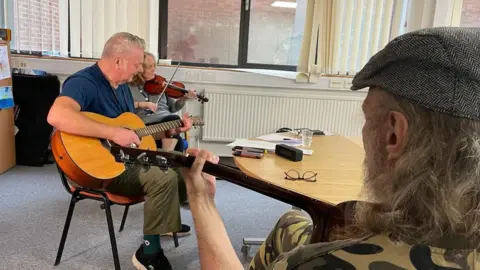BBC A music therapy session at the service