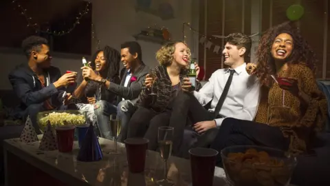 Getty Images Six people having a party