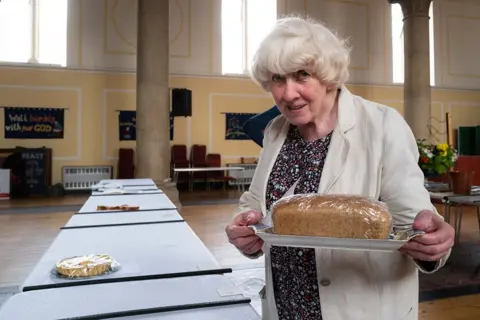 Jim Grover Ruth Lyon with her home-baked loaf