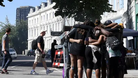 Getty Images Prayers are held near Grenfell Tower