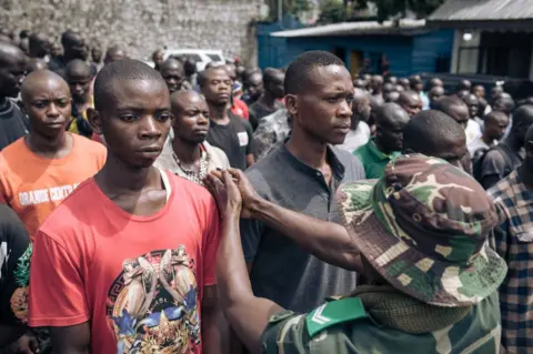 AFP Hundreds of volunteers take part in a session to enlist new recruits into the Congolese army to go to the front against the M23 (March 23 Movement) rebellion, in Goma, on November 7, 2022. - Since October 20, fighting has resumed between the Congolese army and the M23, allegedly backed by the Rwandan army. In the past two weeks, the M23 has doubled the size of the territory under its control, approaching 30 kilometers from Goma, the provincial capital of more than one million people that sits on the border with Rwanda.