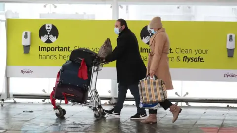 PA Media Passengers at Edinburgh airport, Scotland