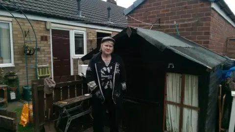 April Fillingham April Fillingham next to wendy house