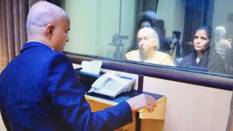 Pakistan foreign ministry Official photos showed Jadhav meeting his mother and wife