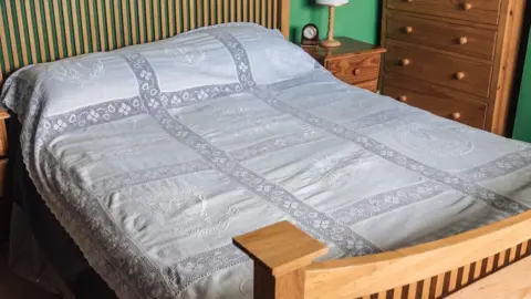 Family photo It bears the insignia of World War One regiments from across the British Empire