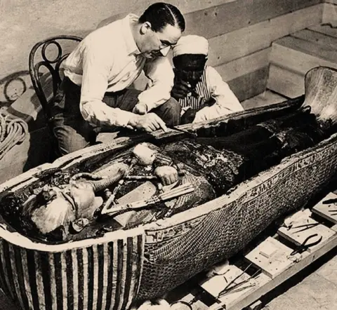 Getty Images Howard Carter inspects the coffin of Tutankhamun, 1925