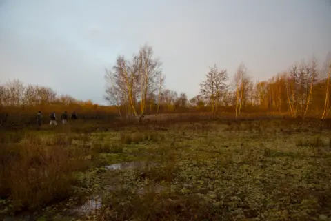 BBC Four men cross a field near Ripley in Surrey