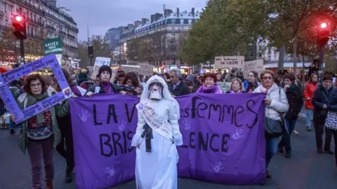 EPA Protesters march in Paris, France. Photo: 23 November 2019