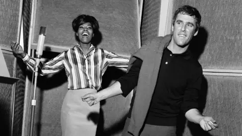 Getty Images Bacharach with Dionne Warwick in the studio in 1964