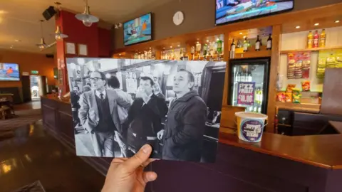 Russell Boyce Men at the bar