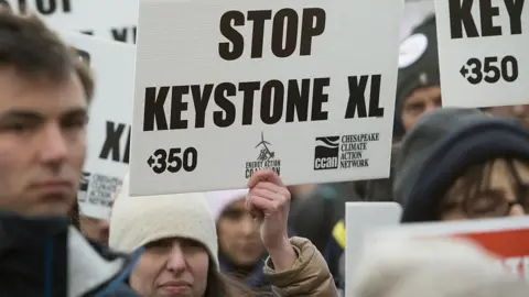 AFP via Getty Images Opponents of the Keystone XL and Dakota Access pipelines hold a rally as they protest Donald Trump's executive orders advancing their construction in 2017