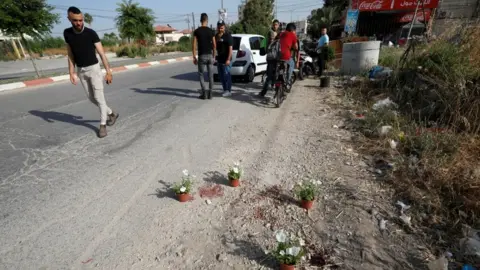 Reuters A man looks at the scene where Palestinian security officers were shot dead in Jenin