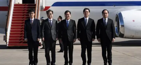 Getty Images The South Korean delegates as they left for North Korea (5 March)