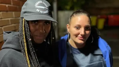 BBC Danyelle King (left) and Jordan Turner (right) Danyelle wearing a change lives no to knives baseball cap and Jordan wearing a stab vest