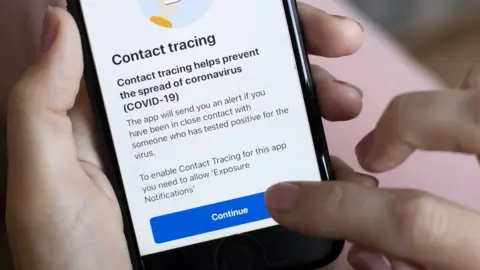 Getty Images A person uses the NHS Covid-19 app