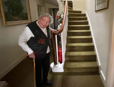 PA Margaret Payne, at the foot of her stairs