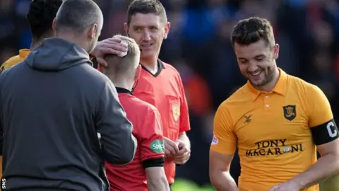 SNS Assistant referee Calum Spence was able to continue after treatment