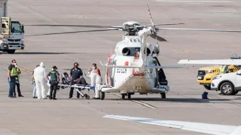 A woman is evacuated in helicopter after being rescued in Telde, Gran Canaria, Canary Islands, Spain, 19 August 2021