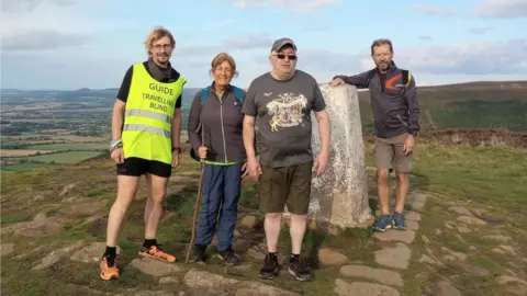 Travelling Blind Andrew Elliker-Reeve and volunteers on Cleveland Way
