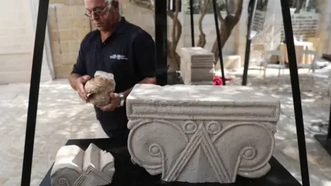 EPA A stone capital, from a palace from the era of a Biblical Jewish kingdom in Jerusalem, is presented by the Israel Antiquities Authority (3 September 2020)