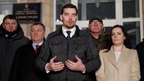 Reuters Prime Minister Oleksiy Honcharuk, (C) Interior Minister Arsen Avakov (second L) and Health Minister Zoryana Skaletska (R)